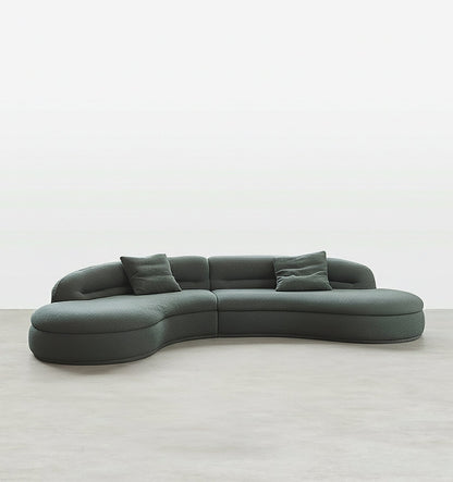 yannik four seater curved sofa, green in modern living room